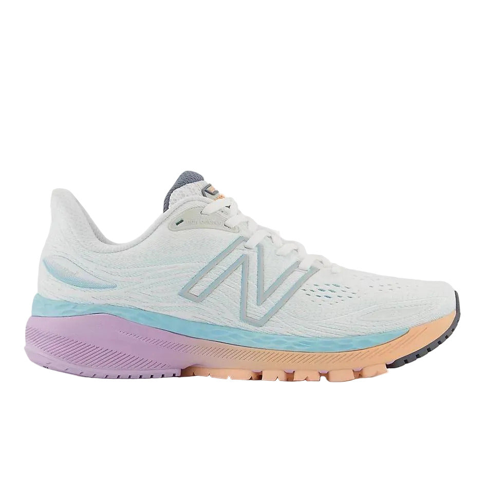Side view on white background of Womens New Balance Fresh Foam X 860v12 running shoe in White/Blue Chill, Narrow width