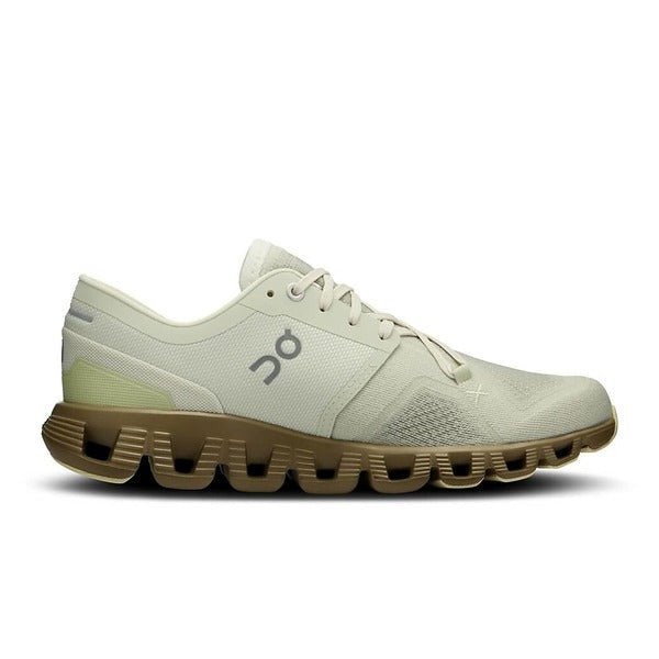 Side view on white background of Womens On Cloud X 3 running shoe in Aloe/Hunter, Medium (Regular) width