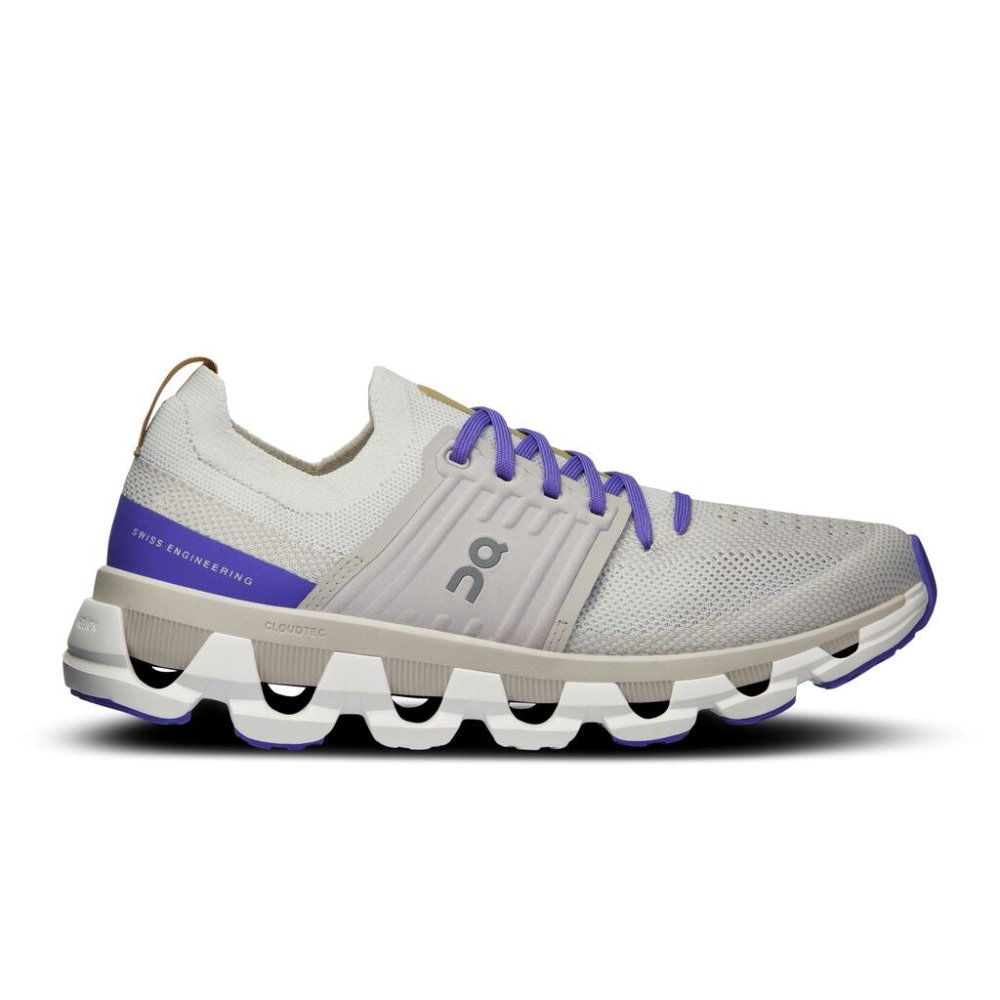 Side view on white background of Womens On Cloudswift 3 running shoe in White/Blueberry, Medium (Regular) width