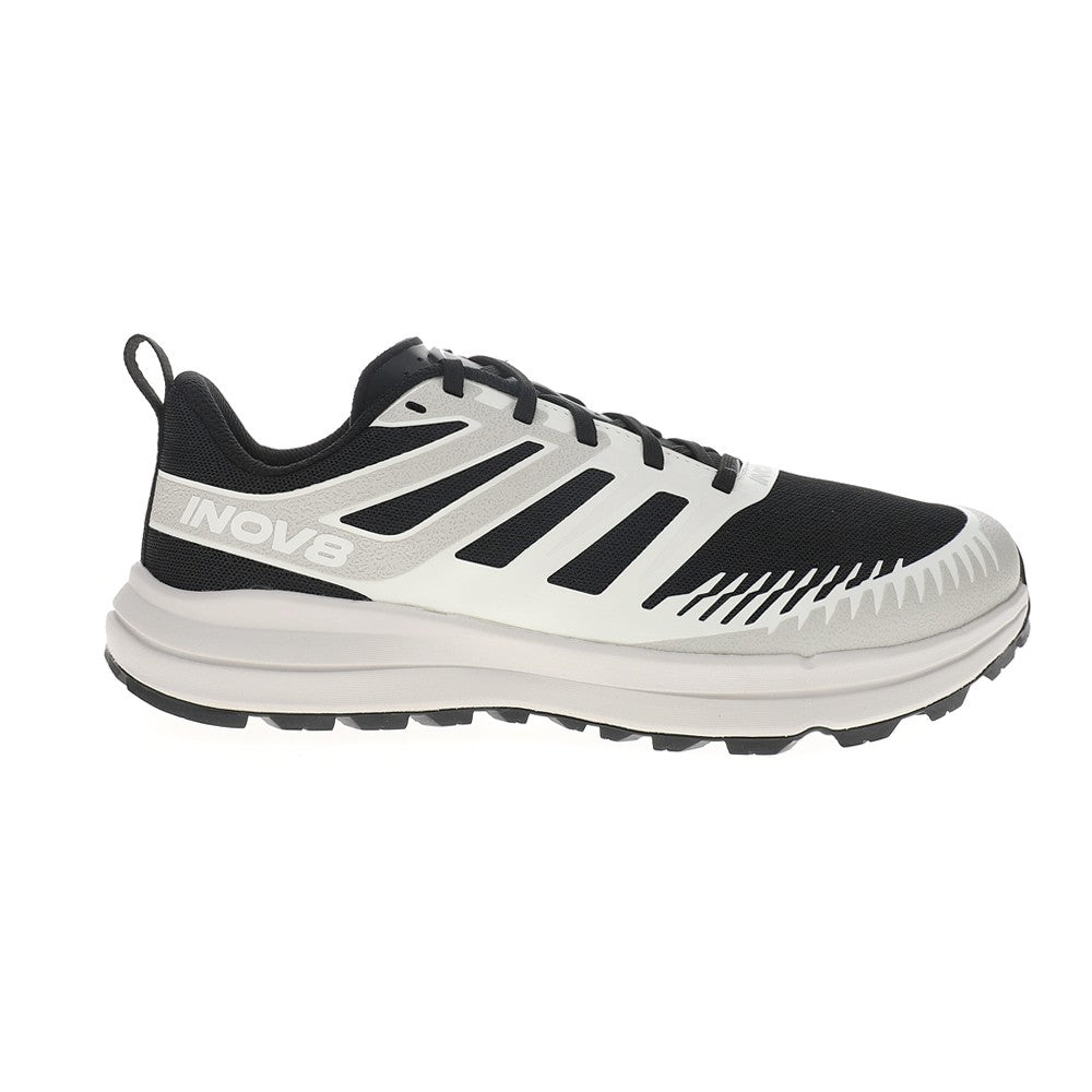 Side view on white background of Mens Inov8 TrailFly Zero running shoe in Black/White, Wide width
