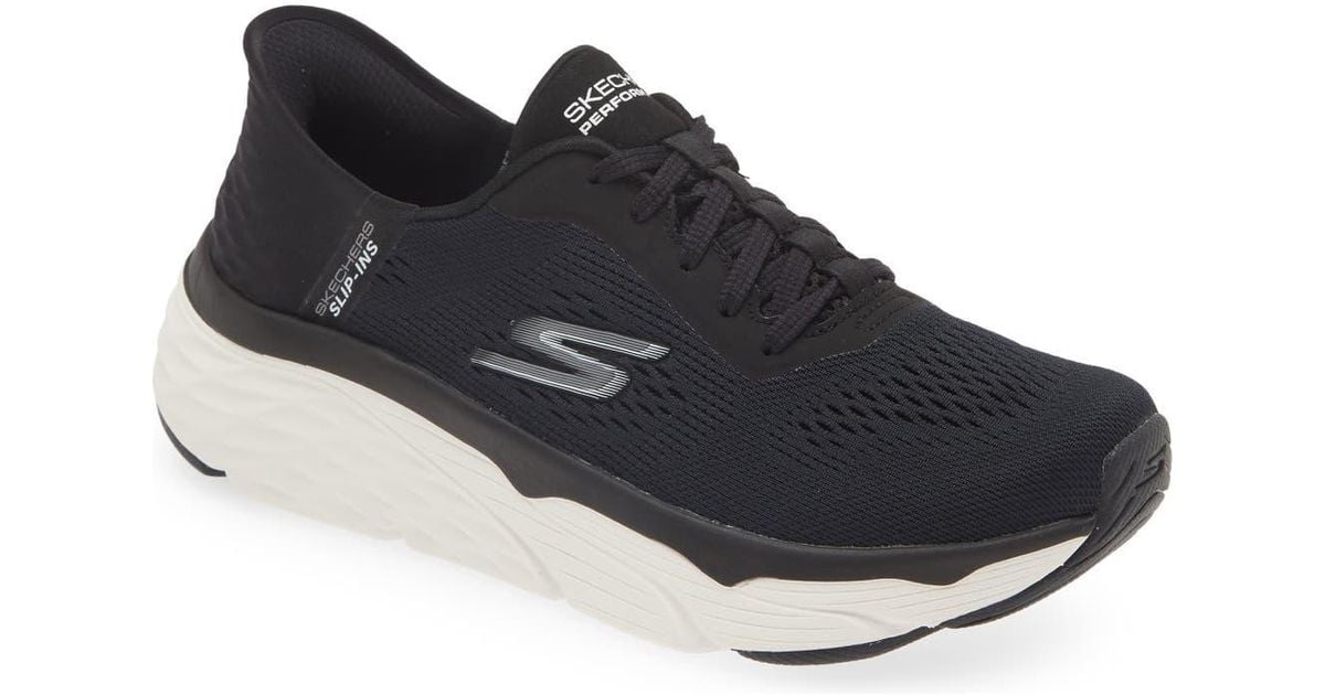 Side view on white background of Womens Skechers Max Cushioning running shoe in Black/White, Medium (Regular) width