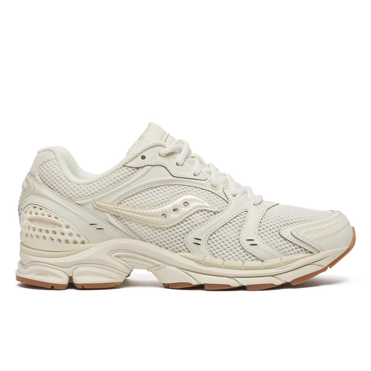 Side view on white background of Mens Saucony Progrid Triumph 4 Heritage running shoe in Almond, Medium (Regular) width