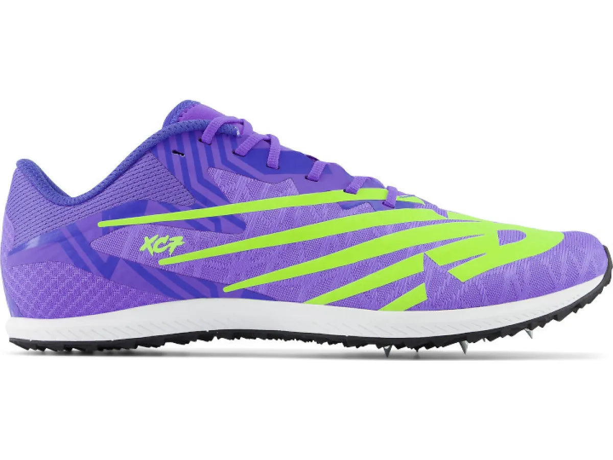 Side view on white background of Mens New Balance XC Seven v4 running shoe in Electric Indigo, Medium (Regular) width