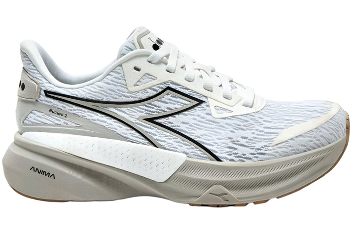 Side view on white background of Womens Diadora Nucleo 2 running shoe in White/Silver, Medium (Regular) width